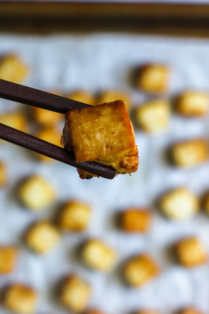 pan fried tofu with chop sticks 