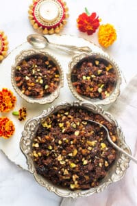 fig halwa served in silver bowls