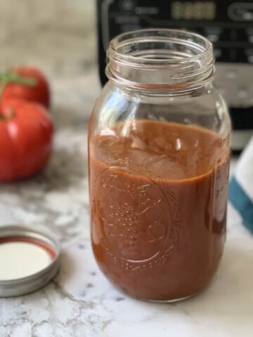 Enchilada sauce in a glass jar
