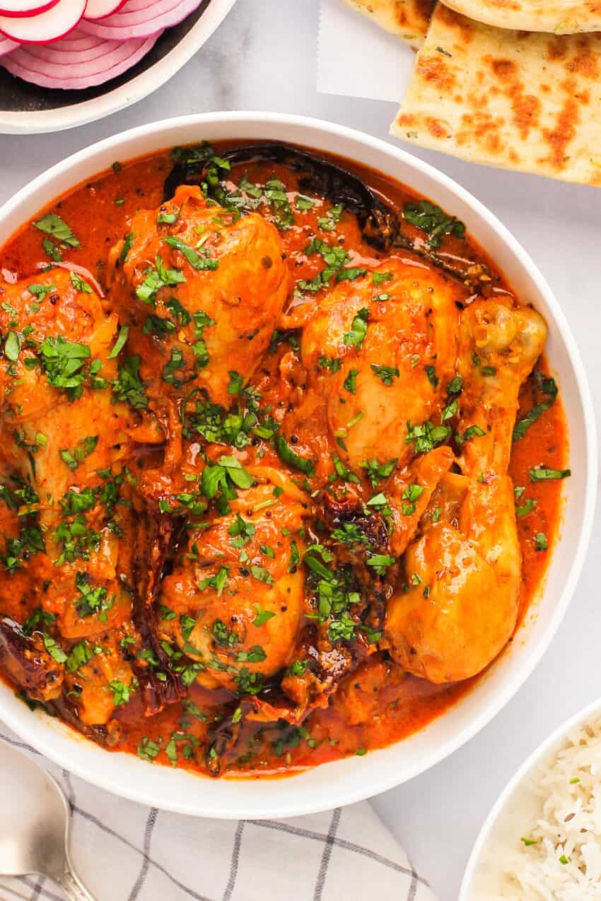 Achari Chicken Curry in a white bowl 