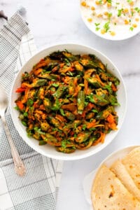 bhindi masala served with roti and raita