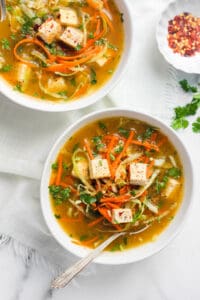 lemon coriander soup in 2 white bowls