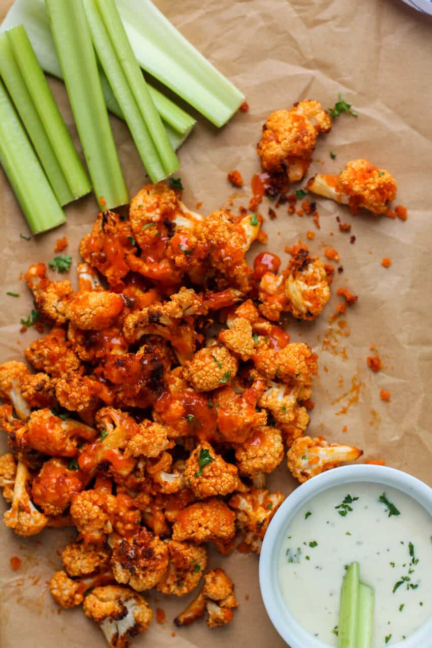 buffalo cauliflower bites served with ranch and celery sticks 