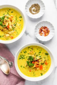 chicken mulligatawny soup served in 2 bowls