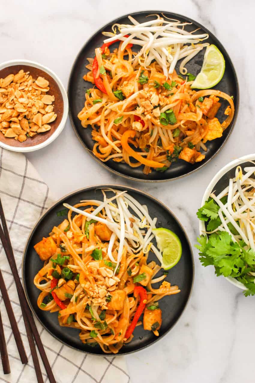 Pad Thai served with bean sprouts and lime wedges 