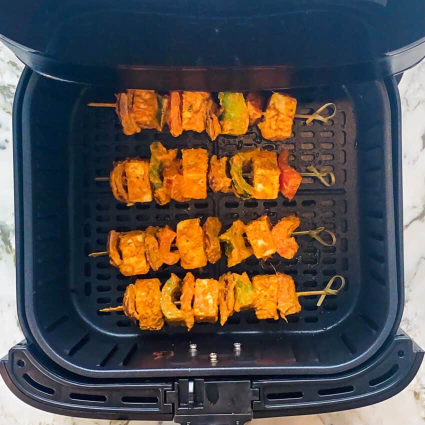 paneer tikka skewers in air fryer basket 