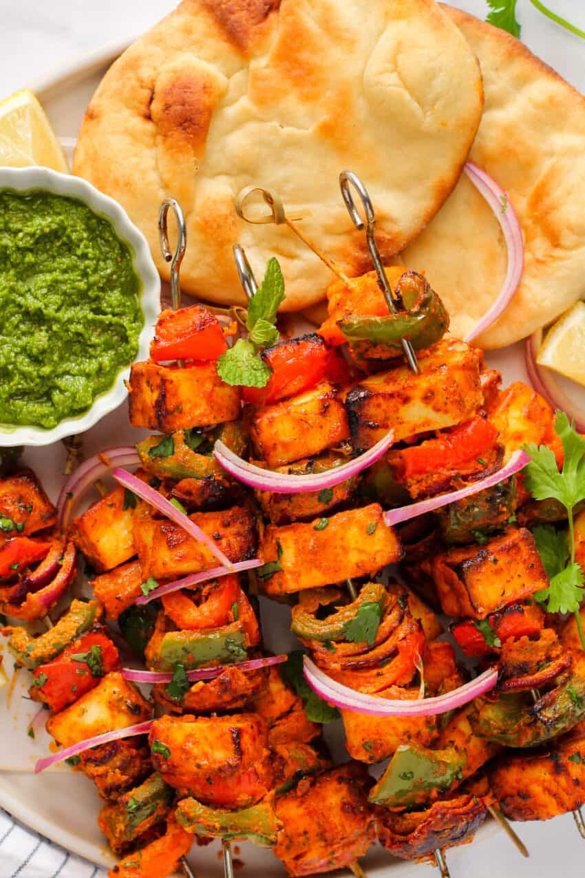 paneer tikka served with chutney and naan