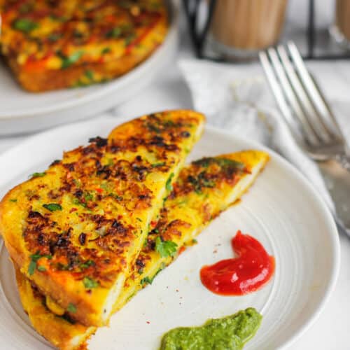 masala french toast served with chutney and ketchup
