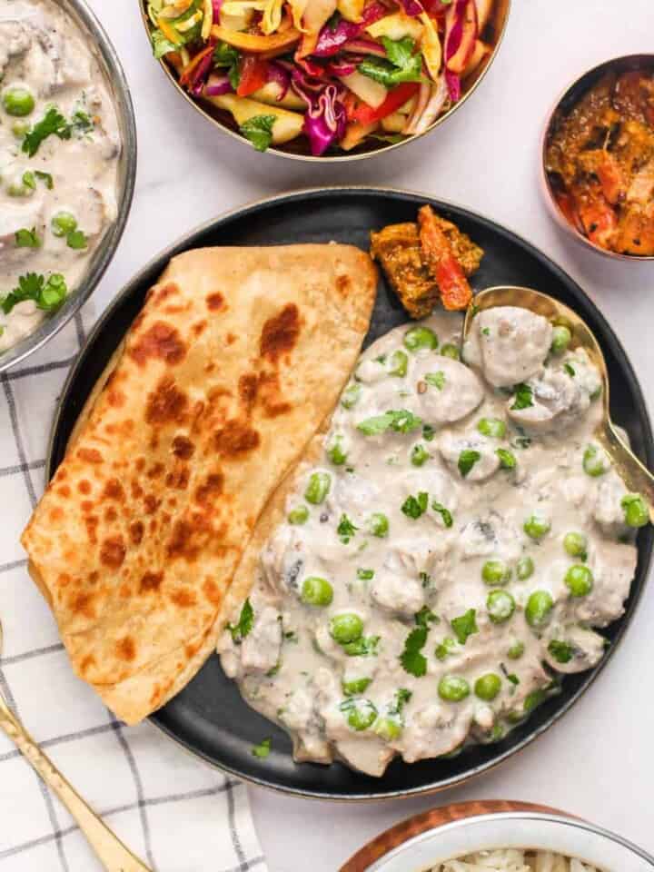 mushroom matar malai served with paratha, rice and cabbage salad