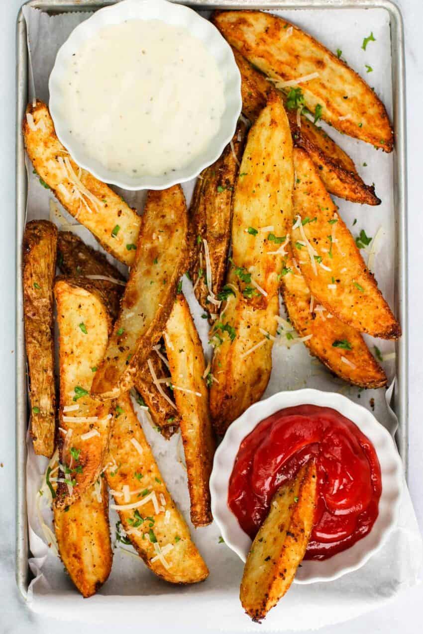 potato wedges served with ketchup 