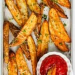 potato wedges served with ketchup