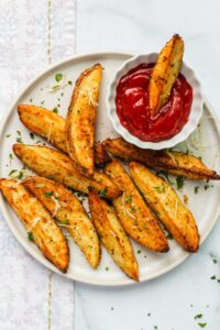 potato wedges served with ketchup