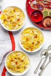 sweet coconut rice served in 3 white bowls