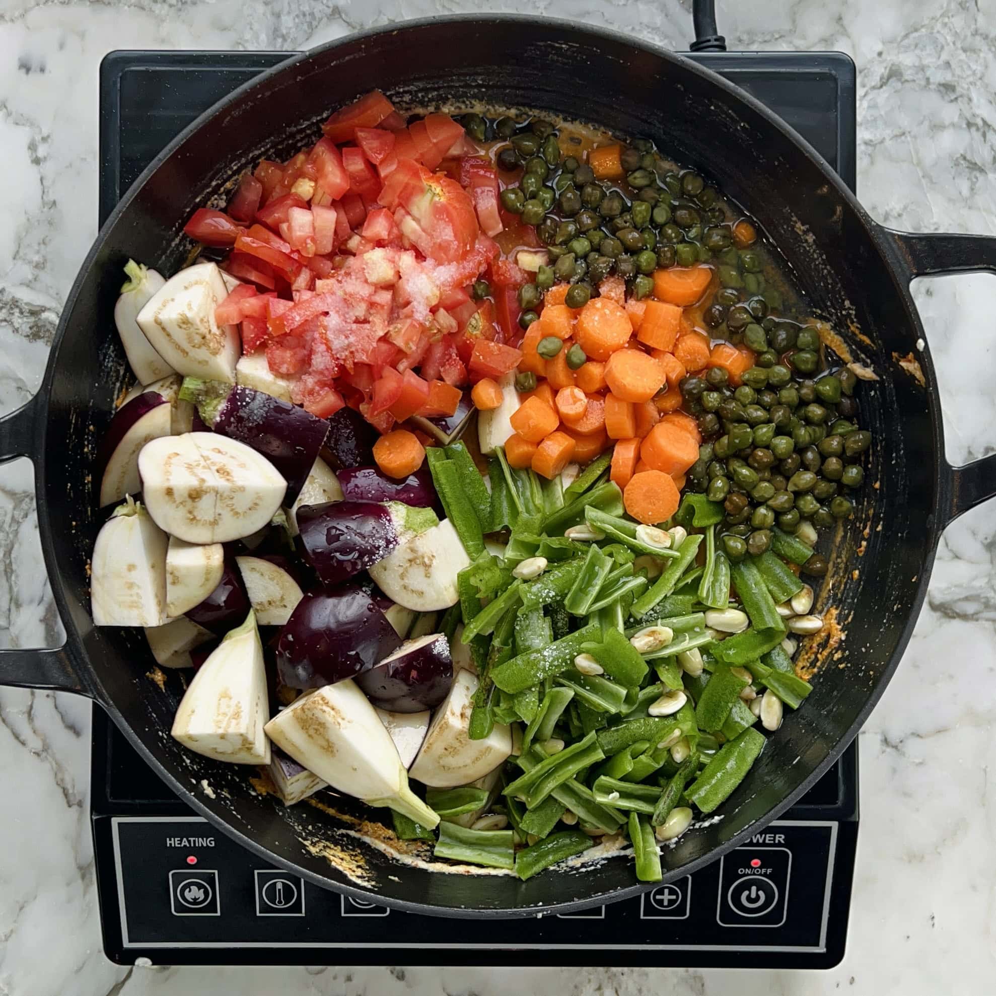veggies added to sauteed spice paste.
