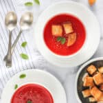 tomato and beet soup served with croutons