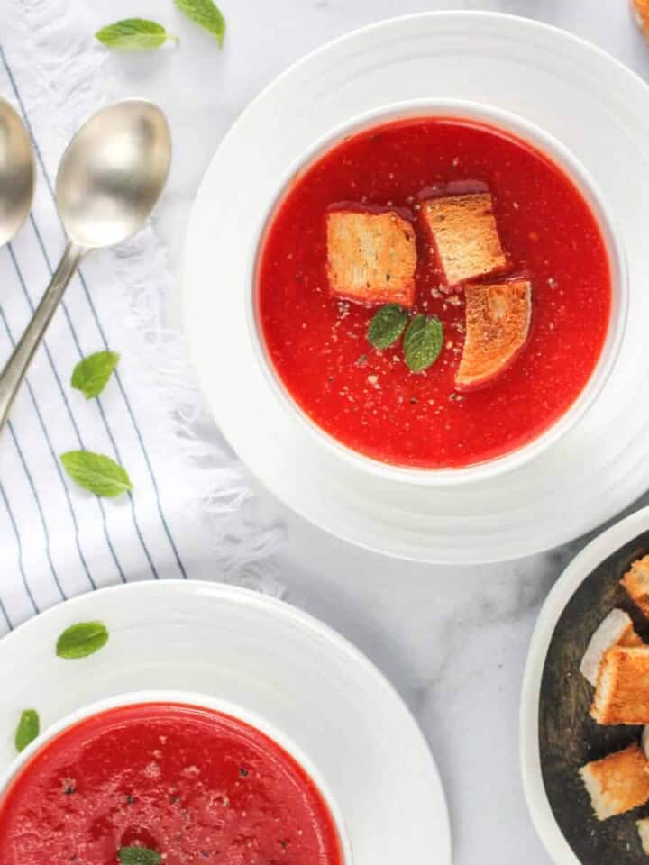 tomato and beet soup served with croutons
