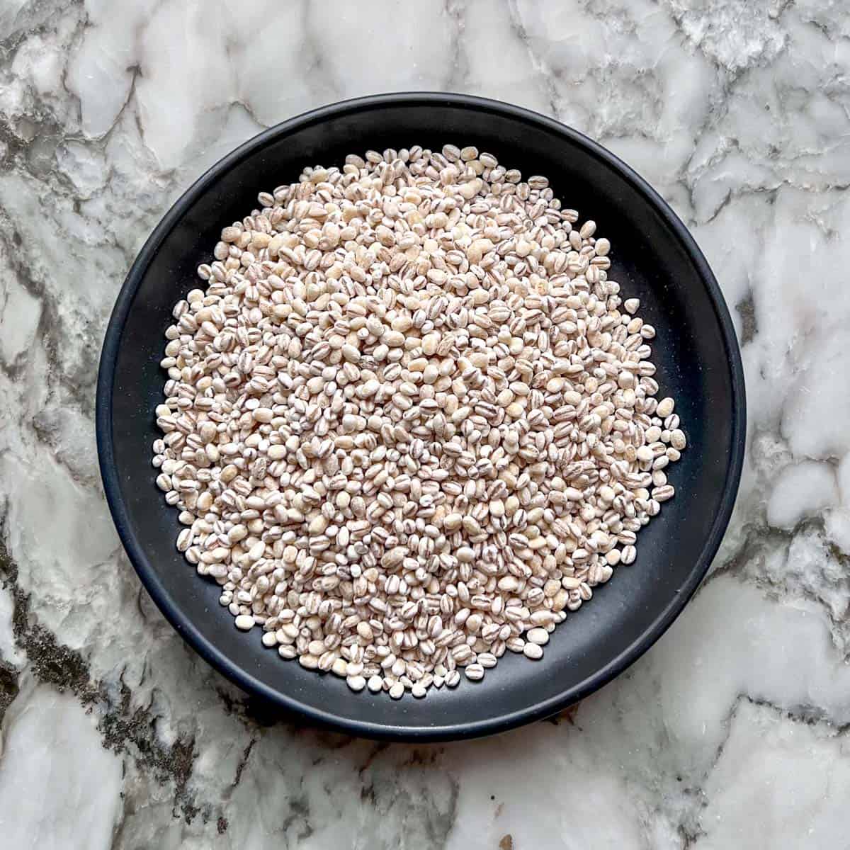 pearled barley in a black bowl 