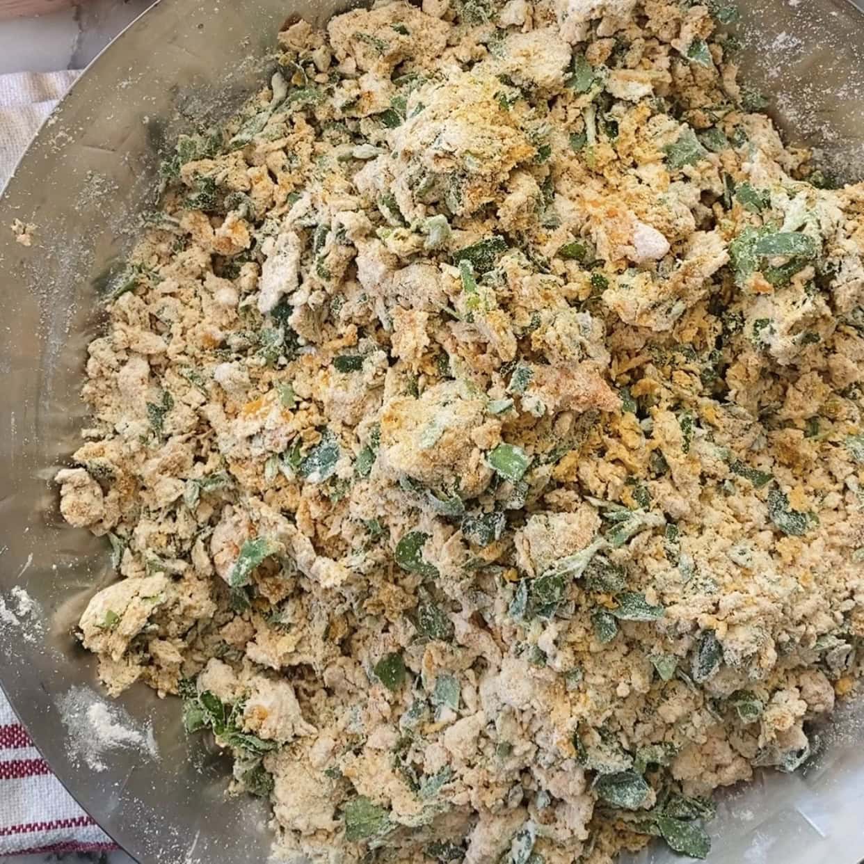 partially formed dough in a mixing bowl.