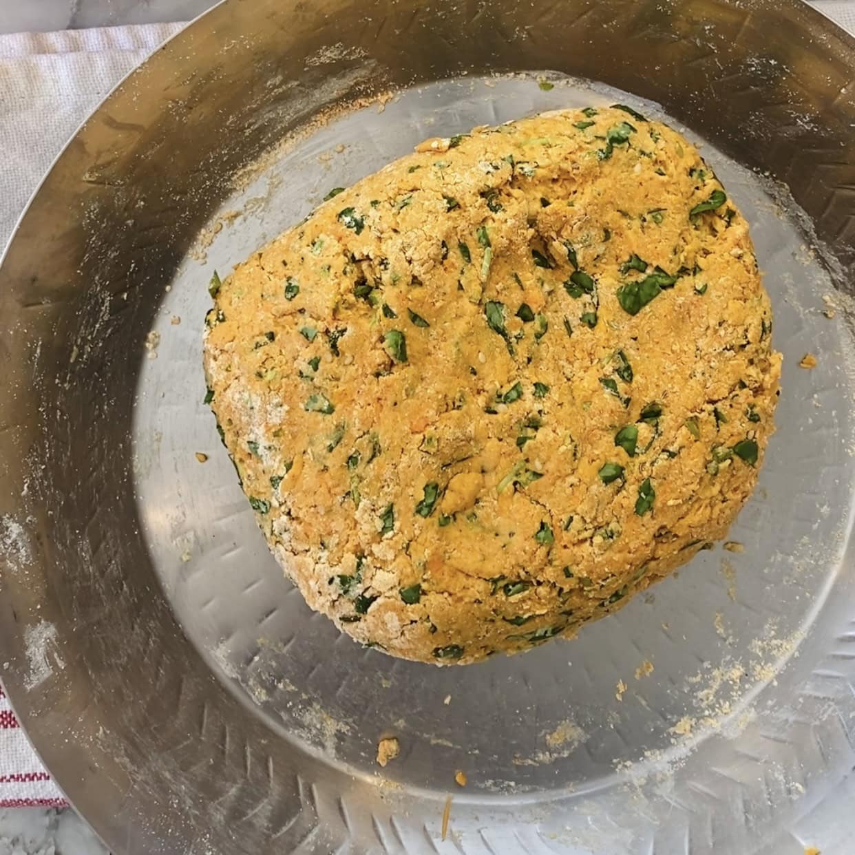 methi thepla dough in the mixing bowl.