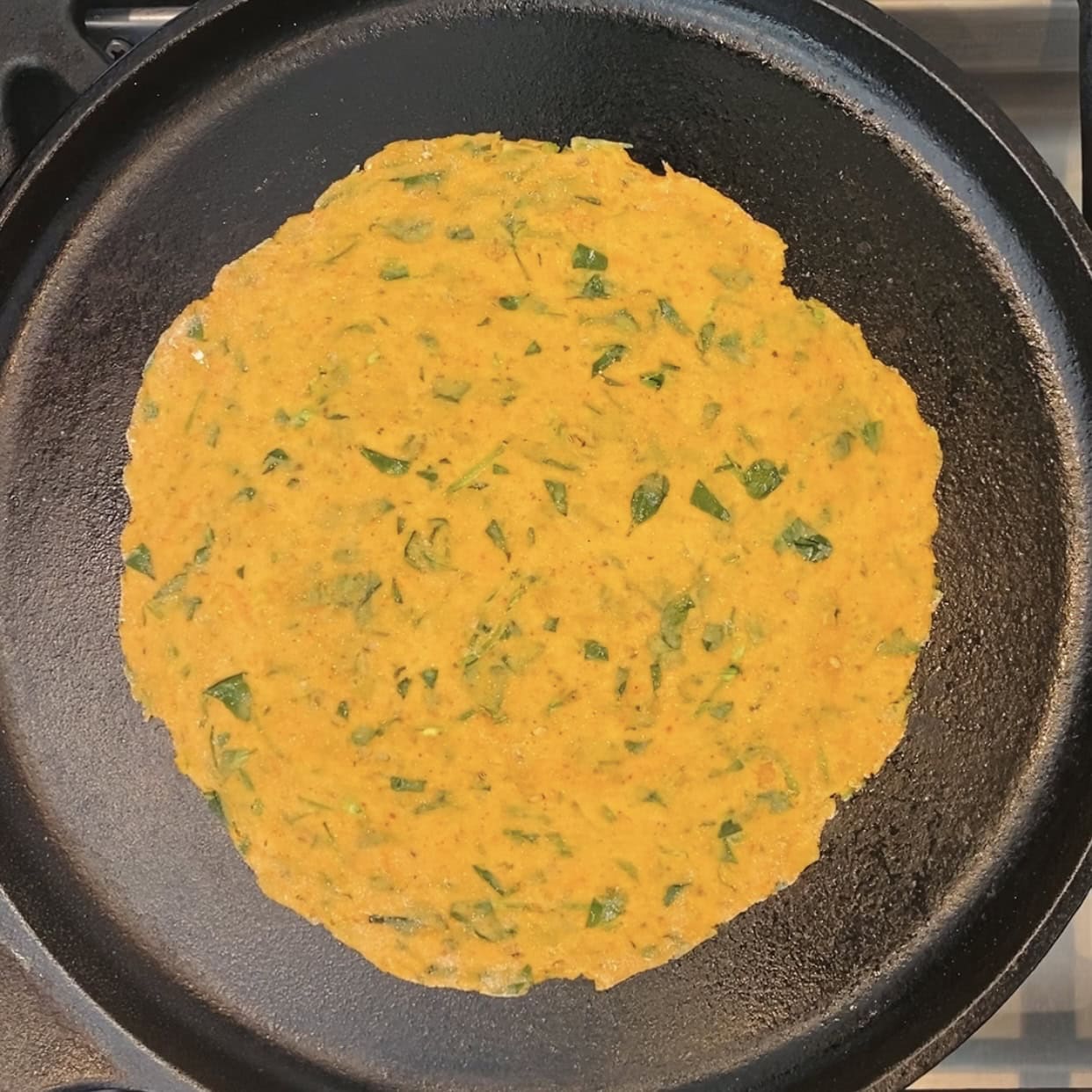 rolled methi thepla on a preheated pan. 