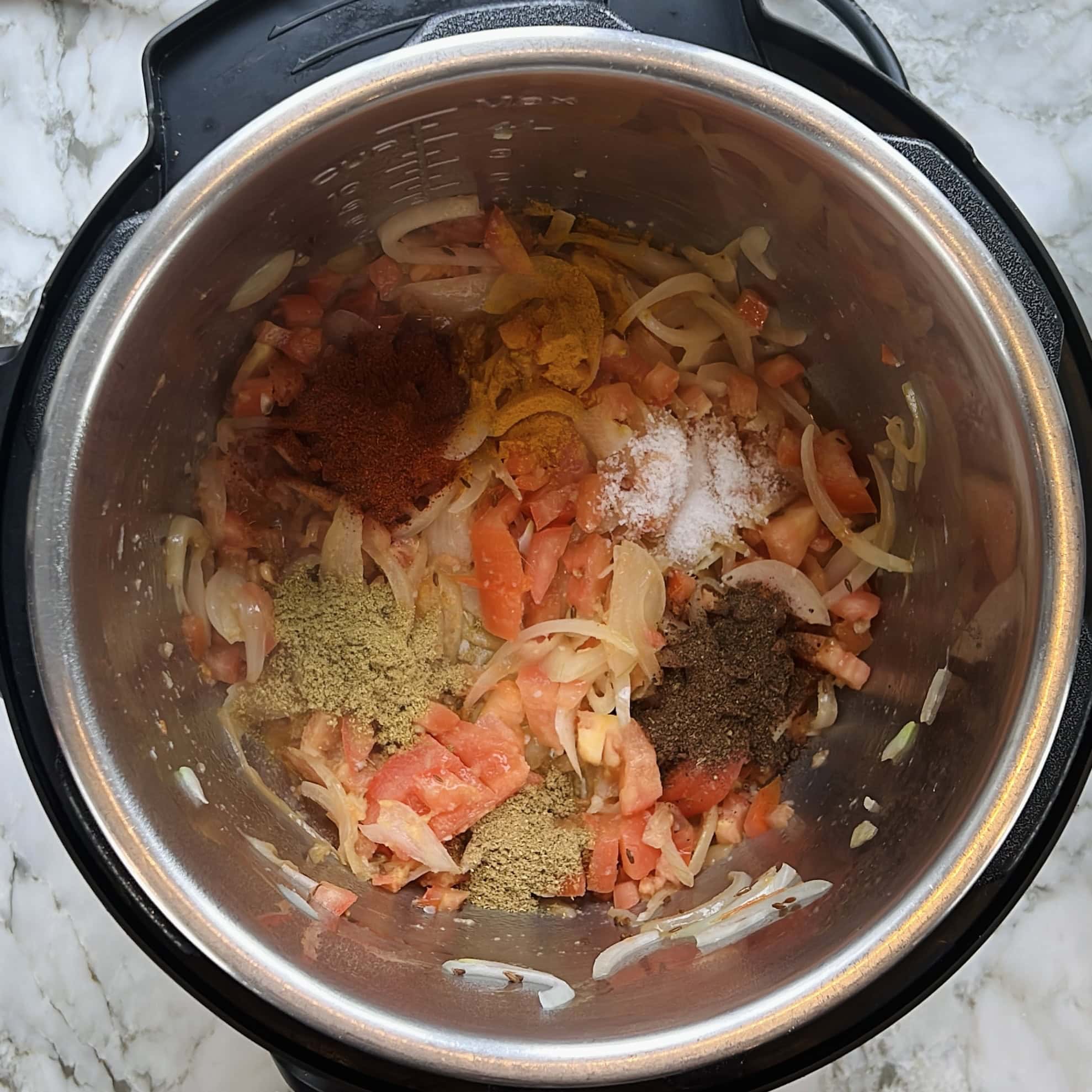 ground spices added to the Instant Pot.