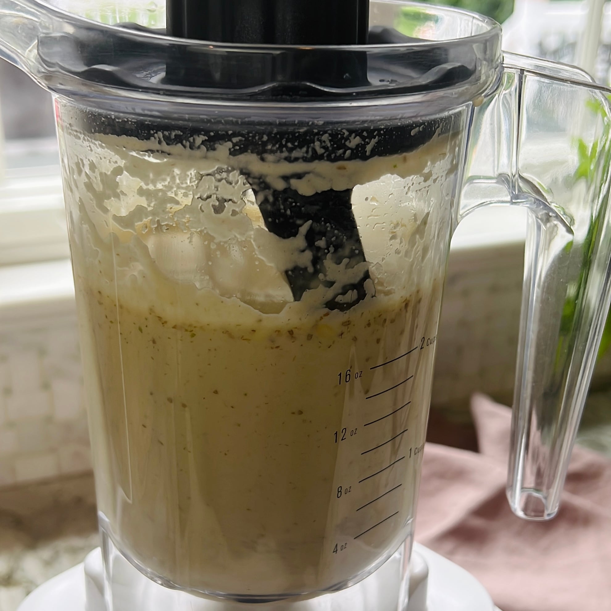 A blender filled with blended lentil and spice mixture.