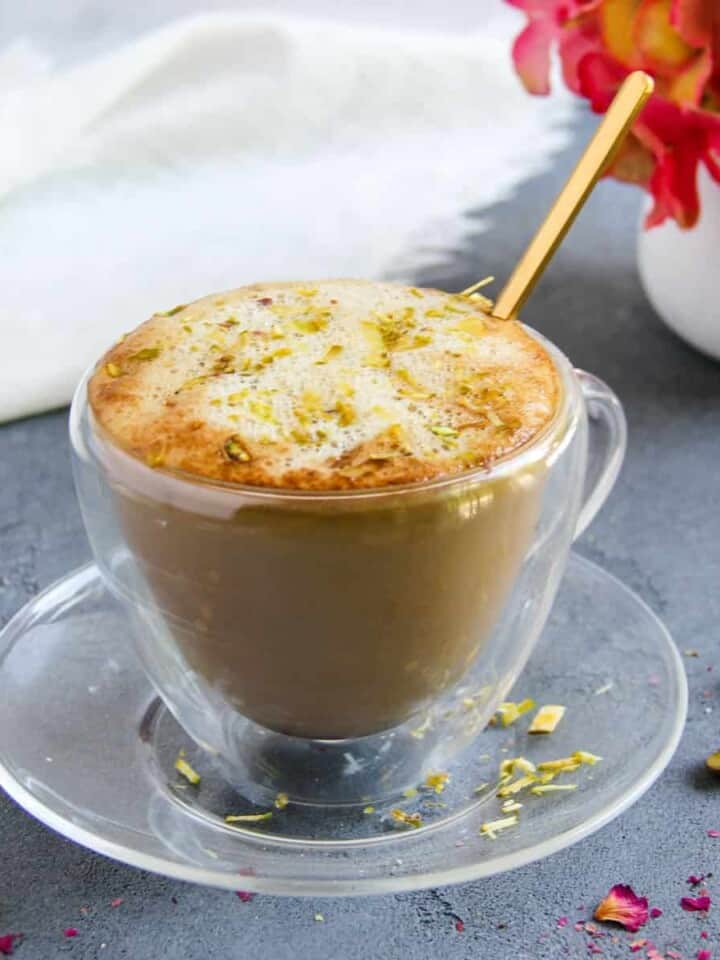 Pistachio latte garnished with sliced pistachios