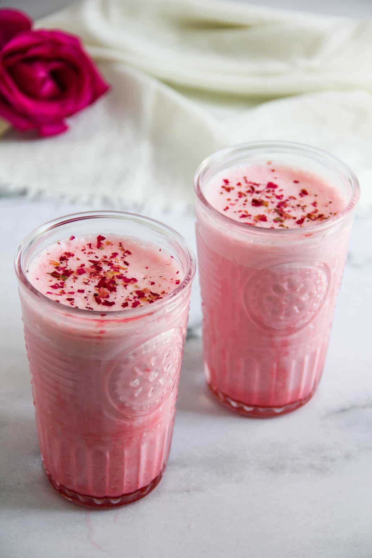 Rose lassi served in two glasses 