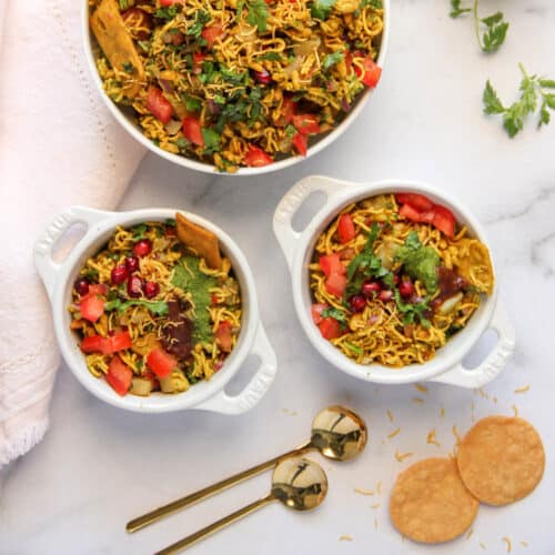 Bhel Puri in 2 small bowls and a serving bowl