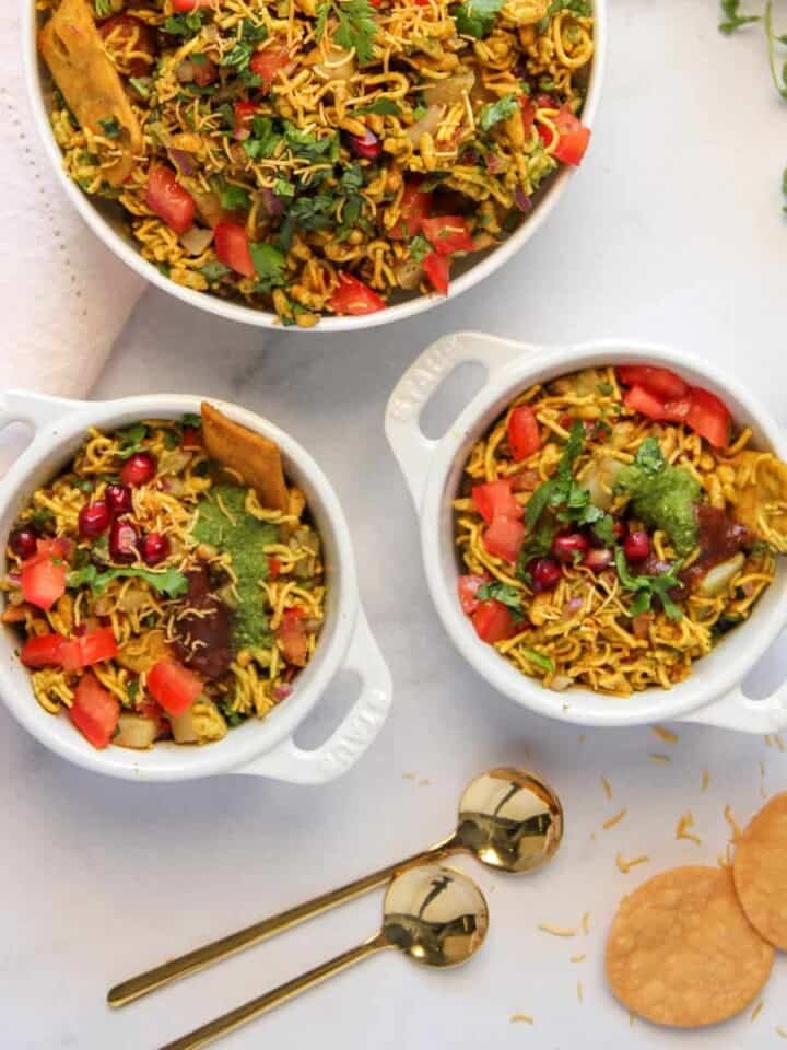 Bhel Puri in 2 small bowls and a serving bowl