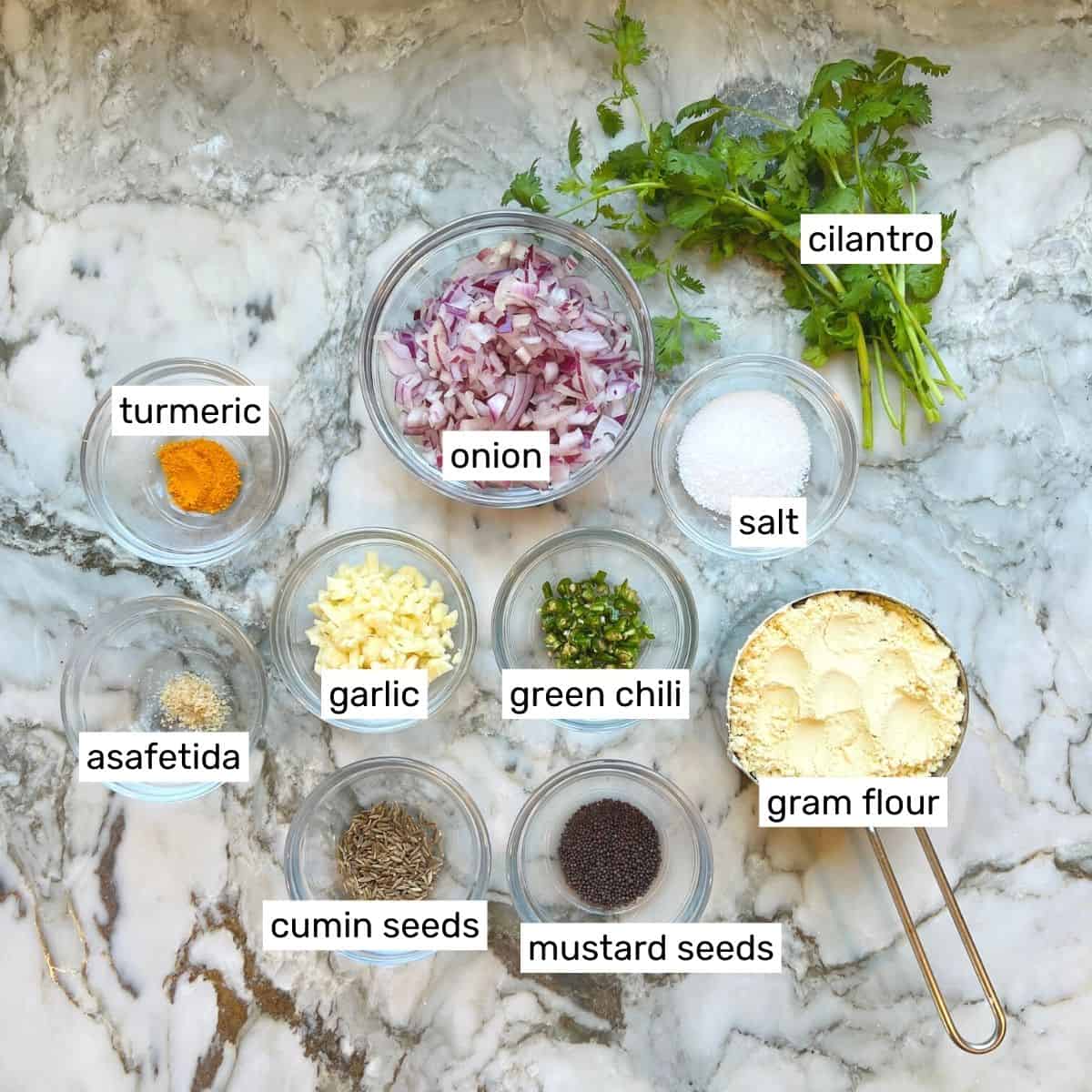 Ingredients to make pithala in individual bowls 