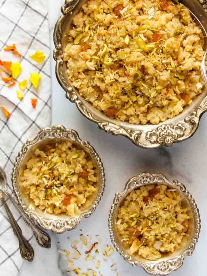 sheera in silver bowls along with spoons