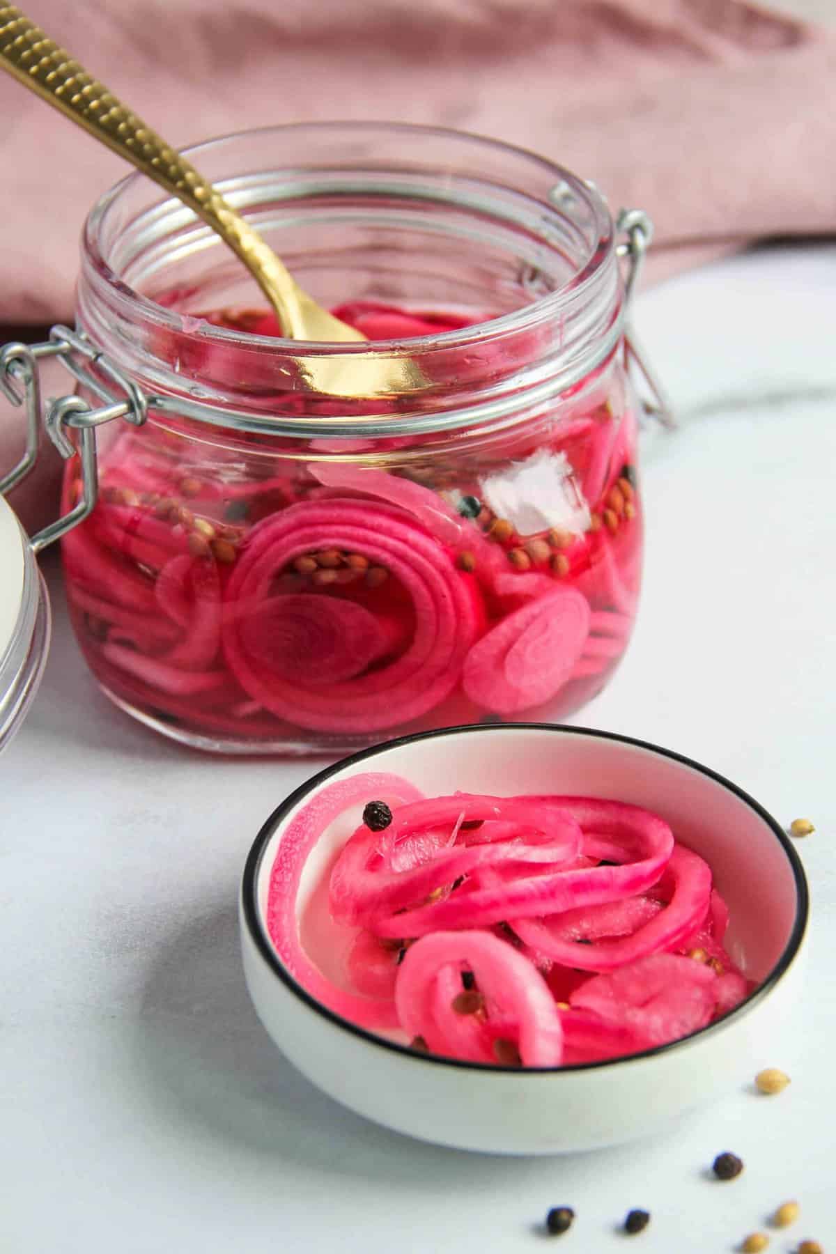 pickled onions in a jar and small bowl