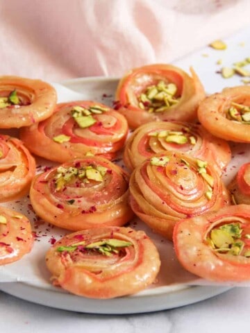 chirote garnished with pistachios in a platter
