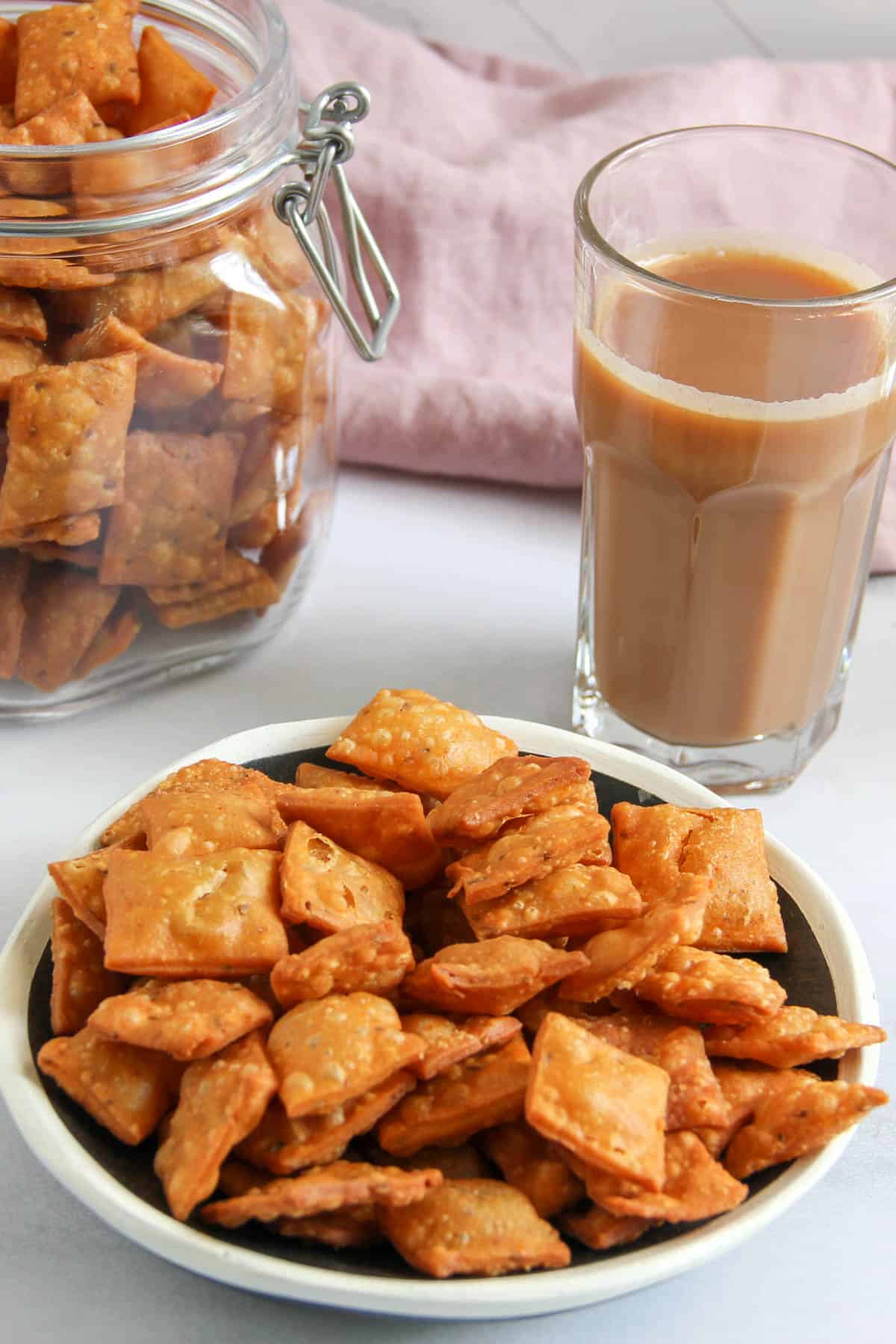 namakpare in a bowl served with chai 