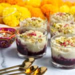 rice pudding with berry compote in small glass jars