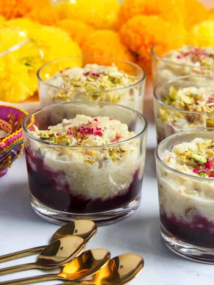 rice pudding with berry compote in small glass jars