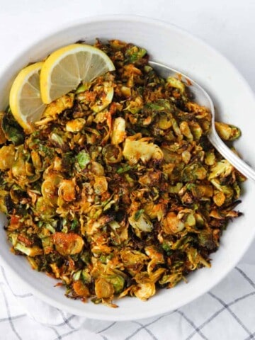 crispy Brussels sprouts in a white bowl