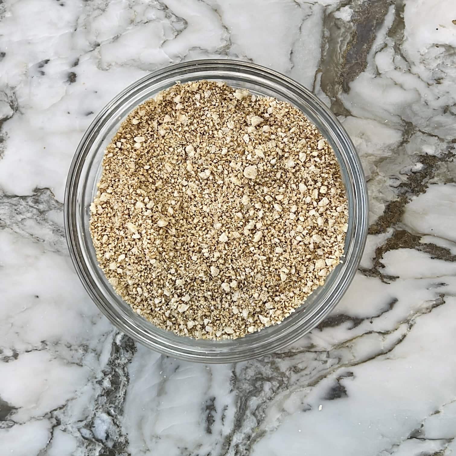 Tilachi vadi dry ingredients in a glass mixing bowl.
