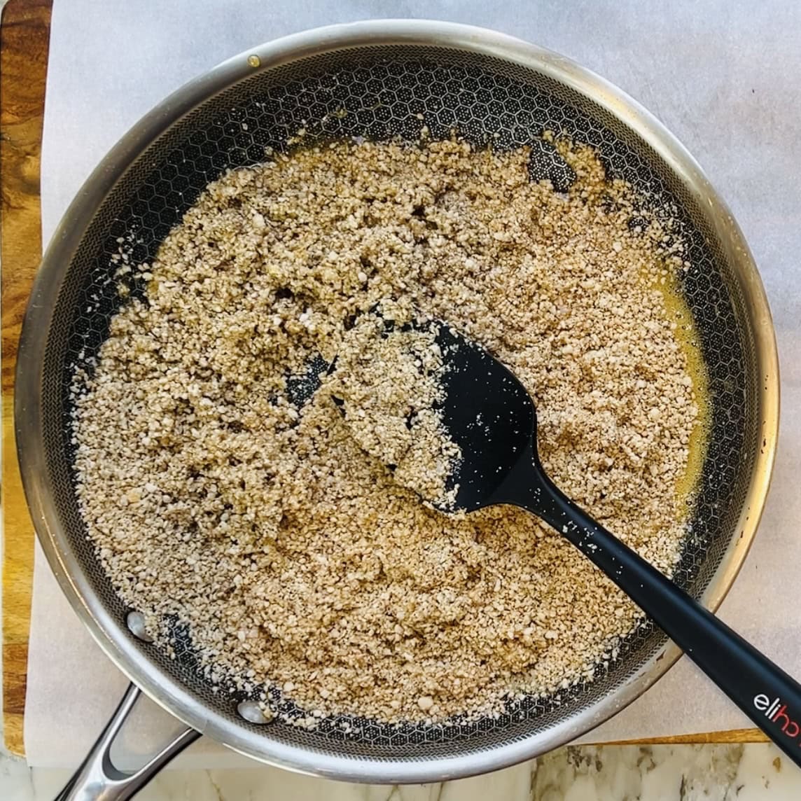 Til vadi mixture in a non stick pan.