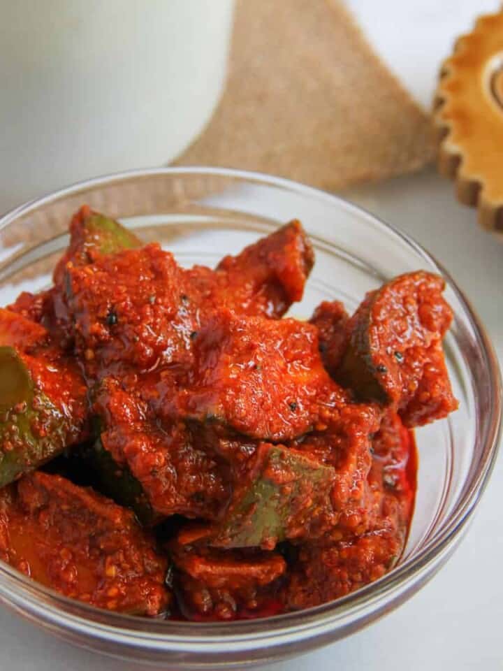 aam ka achar in a glass bowl