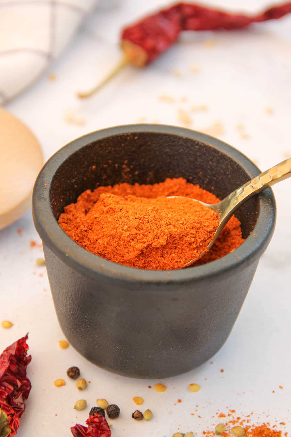 homemade sambar powder in a black jar 
