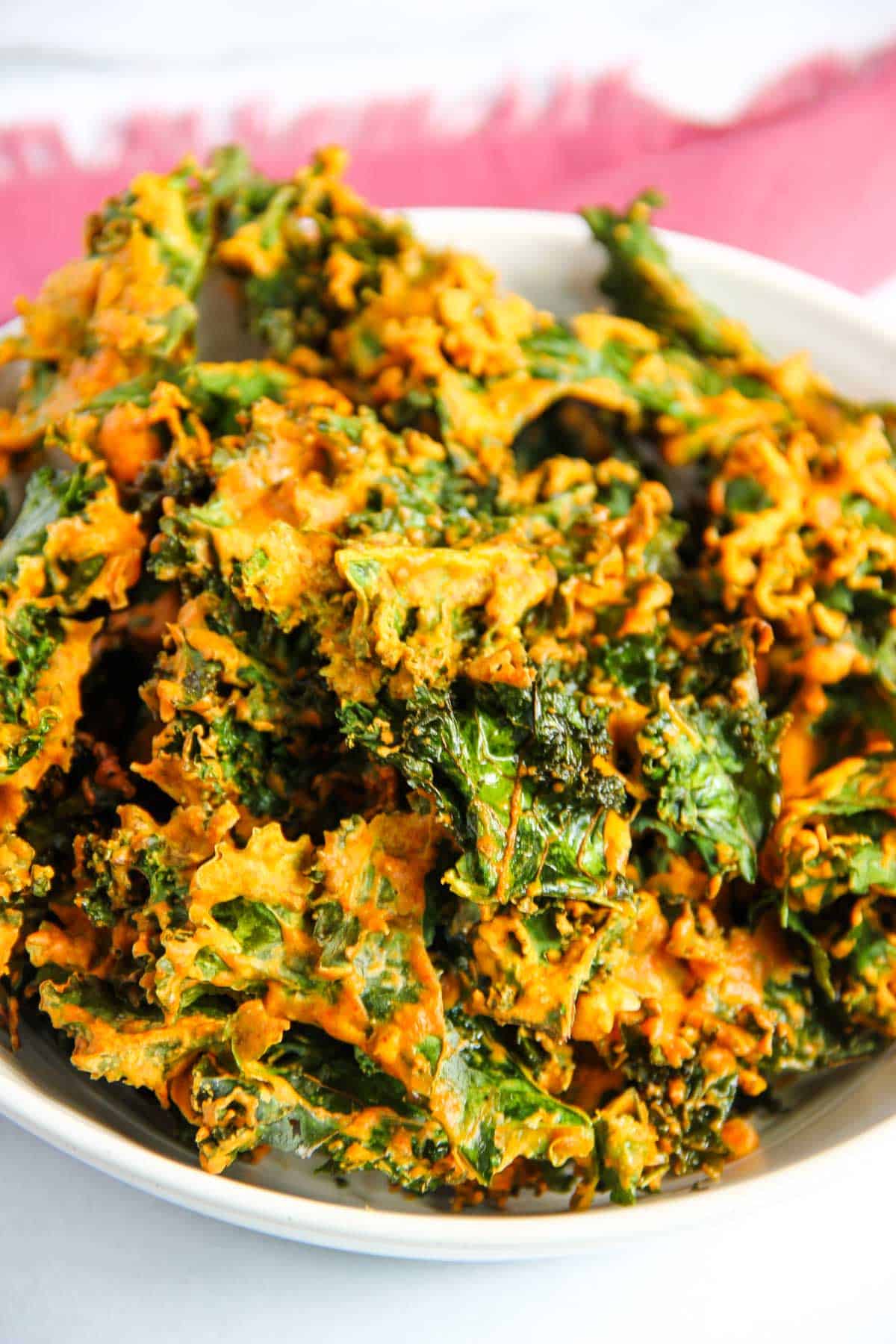 spiced kale chips in a white bowl 