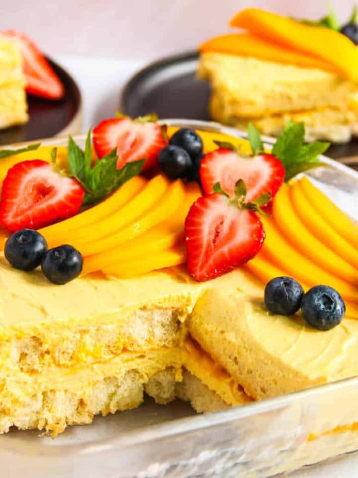 mango tiramisu in a serving bowl and individual plates