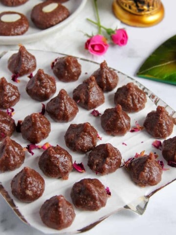 chocolate modak garnished with dried rose petals