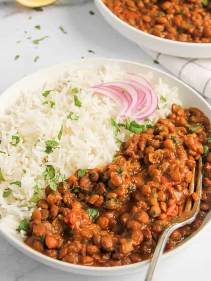 whole masoor dal served alongside basmati rice