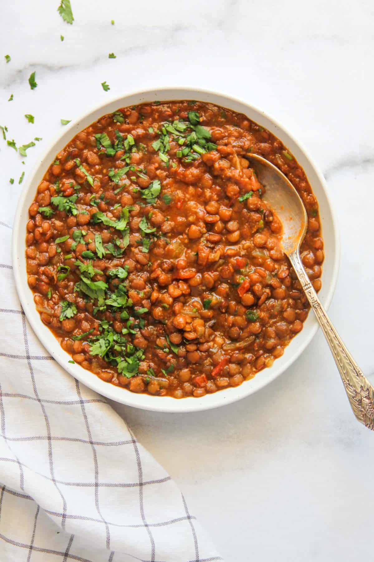 lentils curry garnished with cilantro 