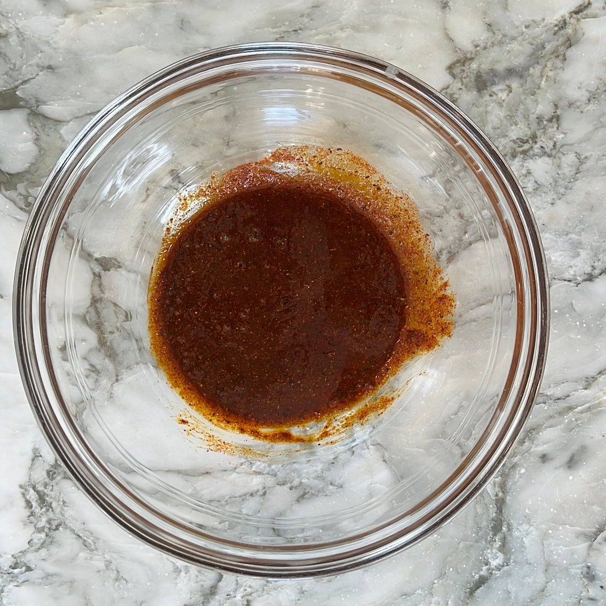 Oil mixed in ground spices.