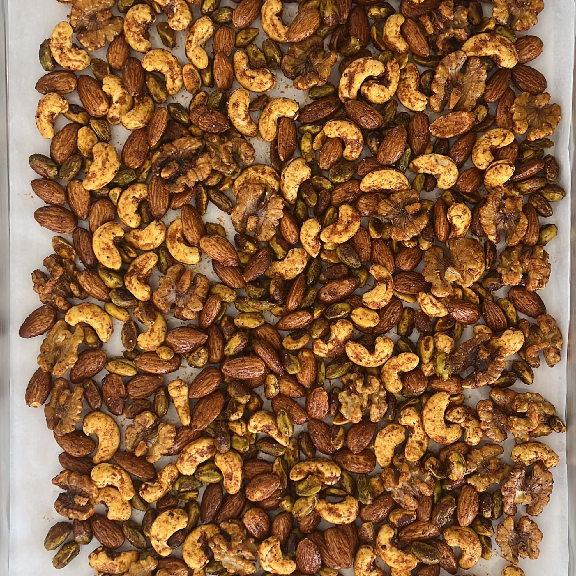 baked masala nuts on baking tray.