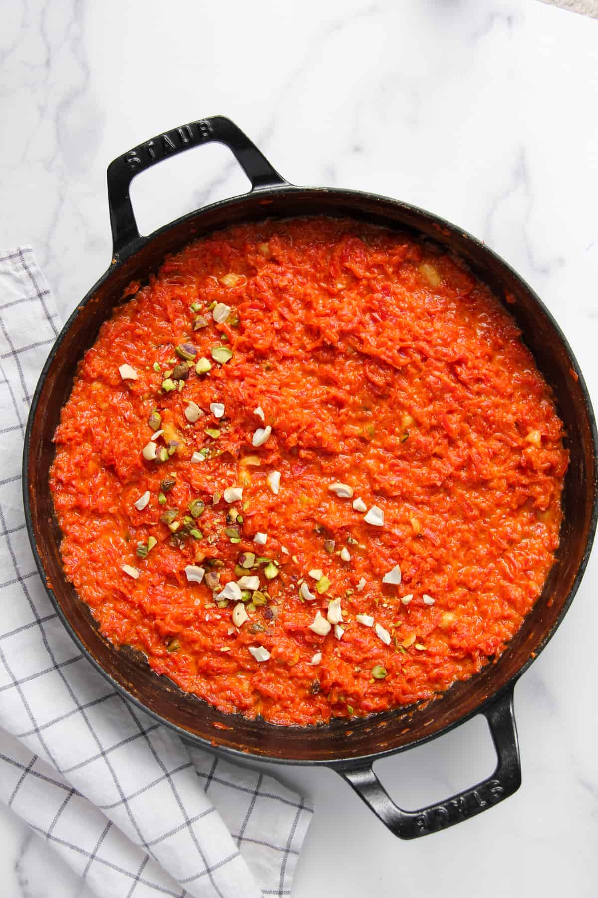 carrot halwa garnished with cashews and pistachios. 